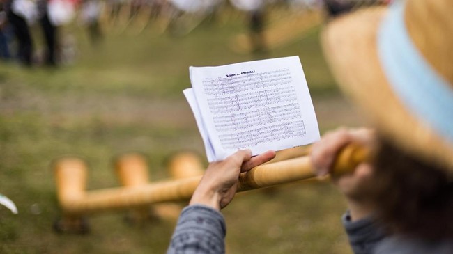 The music score of an alphorn blower on the last day of the International Alphorn Festival on the alpine pasture of Tracouet in Nendaz, in southern Switzerland, July 26, 2026. REUTERS/Pierre Albouy
