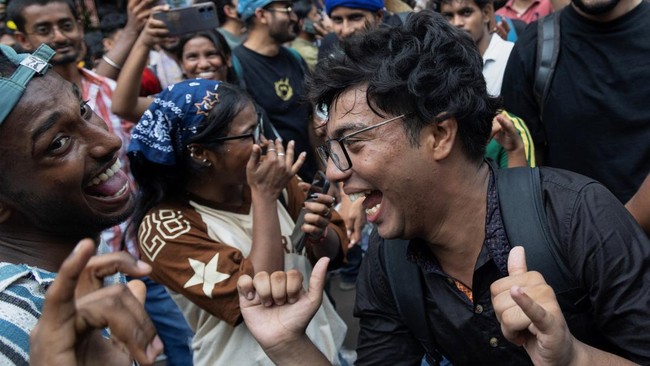 Supporters of India's Cockroach Janta Party (CJP) celebrate after India's Education Minister Dharmendra Pradhan resigned following days of protests demanding his resignation over National Eligibility cum Entrance Test (NEET) examination paper leaks,
