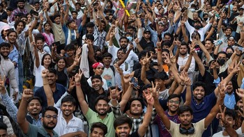 Supporters of India's Cockroach Janta Party (CJP) celebrate after India's Education Minister Dharmendra Pradhan resigned following days of protests demanding his resignation over National Eligibility cum Entrance Test (NEET) examination paper leaks,