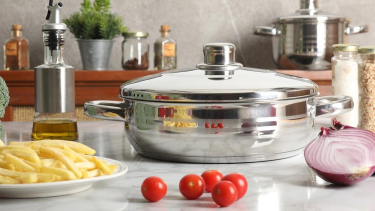set of cooking pans with different utensils