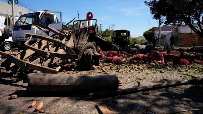 Damaged produce and the wreckage of a truck that was packed with explosives and detonated, lie next to a police station, in Cucuta, Colombia, August 1, 2026, days before the inauguration of President-elect Abelardo de la Espriella in Cali. REUTERS/Lu