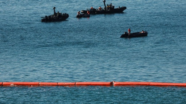 Members of the Royal Moroccan Navy patrol on the Moroccan side of the floating barrier off the border with Morocco, following mass crossings of migrants on foot and by sea from Morocco into Spanish territory, as seen from Ceuta, Spain, August 2, 2026