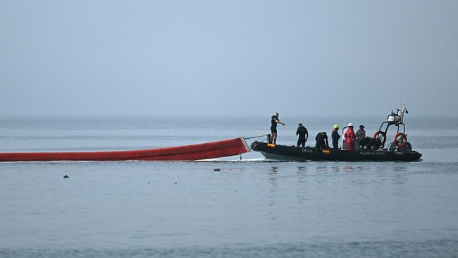 A 500-meter-long (1,640 feet) pneumatic barrier is deployed in the water by a Spanish Guardia Civil boat near the border post to reinforce security following illegal crossings from Morocco into the Spanish enclave of Ceuta, on August 1, 2026. At leas