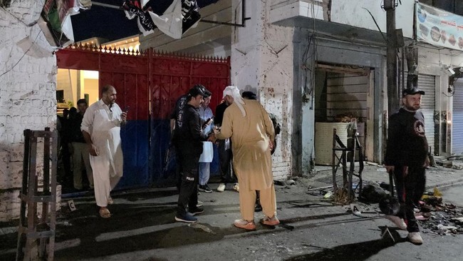 Police officials inspect the site following a suicide bombing during a protest in Pakistan's Swat district on August 2, 2026. A suicide bomber attacked a busy area near a police station during a protest in northern Pakistan's Swat district, killing s