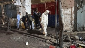 Police officials inspect the site following a suicide bombing during a protest in Pakistan's Swat district on August 2, 2026. A suicide bomber attacked a busy area near a police station during a protest in northern Pakistan's Swat district, killing s