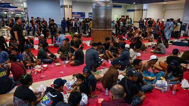 Survivors of the Mutiara Sentosa 2 ferry which caught fire in the waters off Madura island, East Java, on August 2, 2026, gather at Tanjung Perak port in Surabaya early on August 3, 2026. An Indonesian ferry caught fire at sea on Sunday, killing five