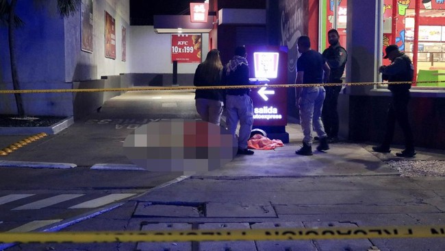 Forensic technicians and police officers work at the crime scene where Mexican social media influencer Cesar Gastelum, known for his comedy videos and followed by nearly 600,000 people on TikTok, was shot and killed while livestreaming with friends o