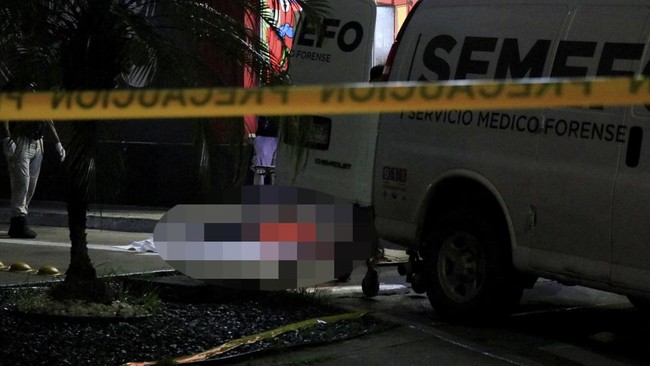 SENSITIVE MATERIAL. THIS IMAGE MAY OFFEND OR DISTURB    Forensic technicians and police officers work at the crime scene where Mexican social media influencer Cesar Gastelum, known for his comedy videos and followed by nearly 600,000 people on TikTok