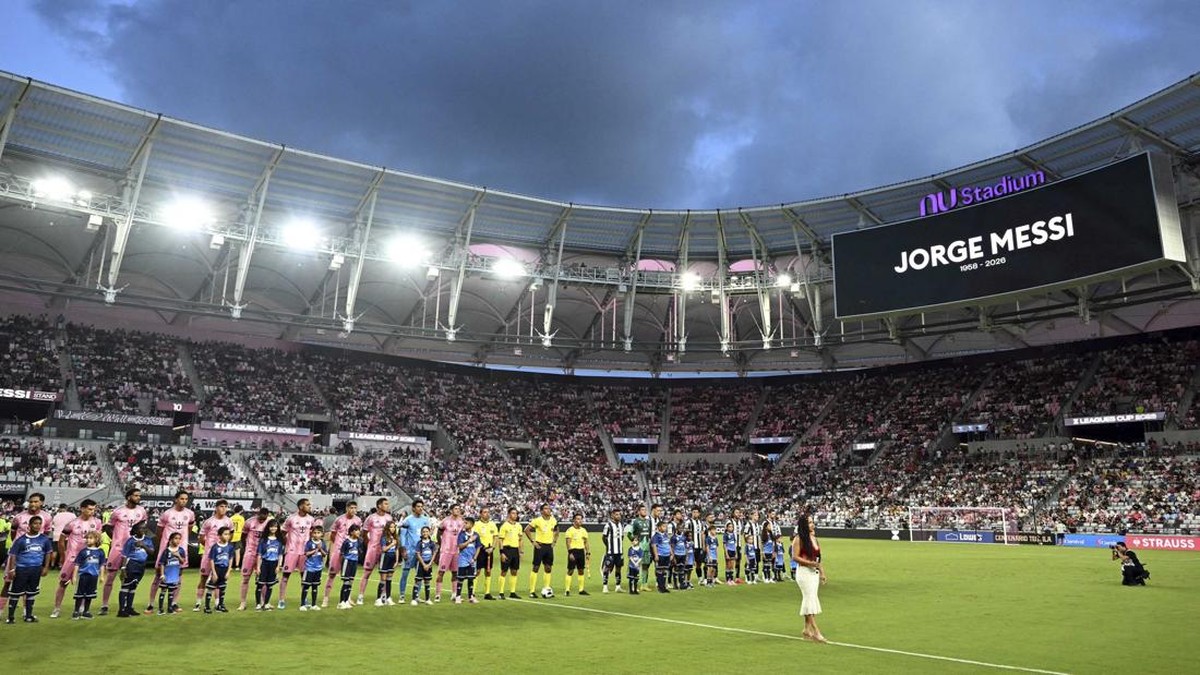 Inter Miami (L) and Monterrey players stand on the pitch during a tribute to Jorge Messi, the father and agent of Lionel Messi, ahead of the Leagues Cup 2026 group-stage football match between Inter Miami CF and Monterrey at Nu Stadium in Miami, Flor