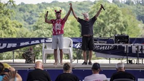 Participants in the French pig-squealing championship perform on stage at the 43rd edition of the Pig Festival, in Trie-sur-BaÔse, south-western France, on August 9, 2026. (Photo by Valentine CHAPUIS / AFP)