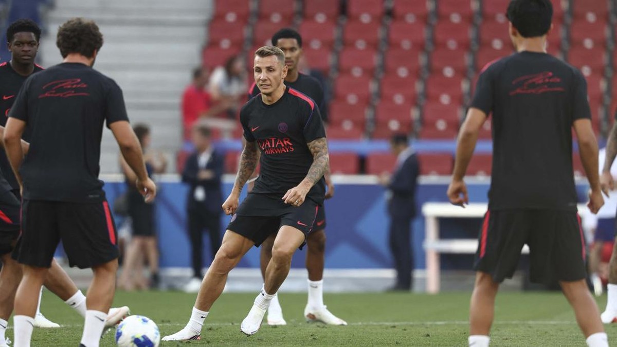 Paris Saint-Germain's players including new French defender #12 Lucas Digne (C) take part in a training session on August 11, 2026, the eve of the UEFA Supercup football match between Champions League winners Paris Saint Germain (PSG) and Europa Leag