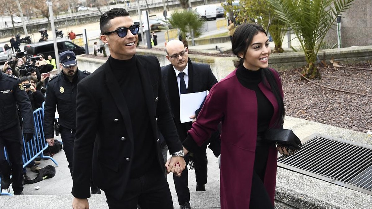 Juventus' forward and former Real Madrid player Cristiano Ronaldo arrives with his Spanish girlfriend Georgina Rodriguez to attend a court hearing for tax evasion in Madrid on January 22, 2019. Ronaldo is expected to be given a hefty fine after Spani