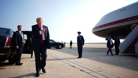 JOINT BASE ANDREWS, MARYLAND - JULY 01: U.S. President Donald Trump gestures to the new Air Force One aircraft as he stops to speak to the media on July 01, 2026 at Joint Base Andrews, Maryland. Trump is traveling to North Dakota to attend the Theodo