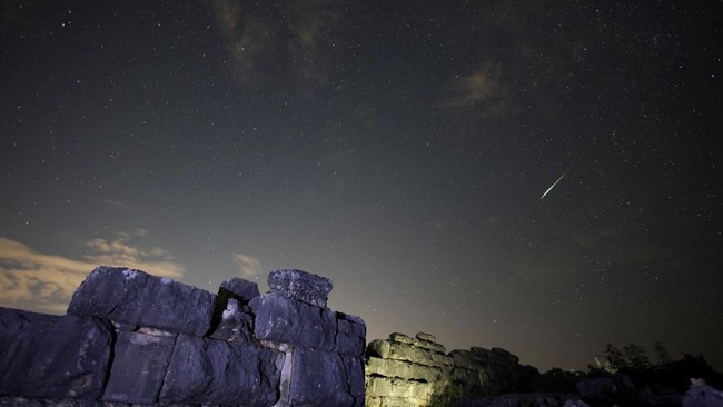 A meteor streaks across the sky during the Perseid meteor shower above the ruins of Daorson, the ancient Illyrian city dating from 300 BC to 50 BC, in Stolac, Bosnia and Herzegovina, August 13, 2026. REUTERS/Amel Emric