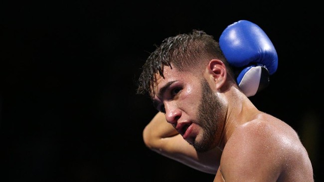 FAIRFAX, VA - OCTOBER 17: Prichard Colon holds the back of his head in a match against Terrel Williams in their super welterweights bout at EagleBank Arena on the campus of George Mason University on October 17, 2015 in Fairfax, Virginia.   Patrick S