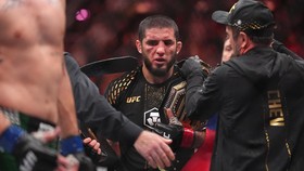 Aug 15, 2026; Philadelphia, Pennsylvania, USA; Islam Makhachev (red gloves) celebrates after defeating Iah Machado Garry (blue gloves) in the welterweight title bout during UFC 330 at Xfinity Mobile Arena. Mandatory Credit: Kyle Ross-Imagn Images