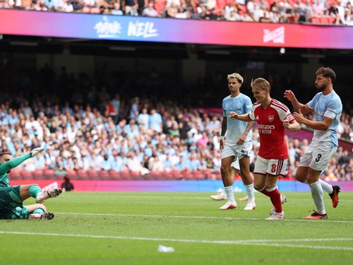 Soccer Football - FA Community Shield - Arsenal v Manchester City - Principality Stadium, Cardiff, Wales, Britain - August 16, 2026 Arsenal's Martin Odegaard scores their third goal past Manchester City's Gianluigi Donnarumma REUTERS/Chris Radburn