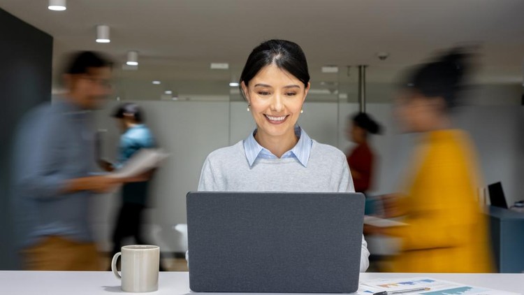 Latin American businesswoman working on her laptop at a busy office - time lapse concepts