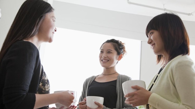 Three businesswomen on the coffee break in the office