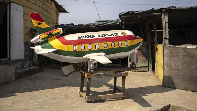 An aeroplane-shaped coffin, designed in reference to the profession of the deceased, a pilot, is pictured at the Erico Carpentry Shop in Accra, on August 17, 2026. Fantasy coffins are a distinctive Ghanaian funerary tradition, particularly associated