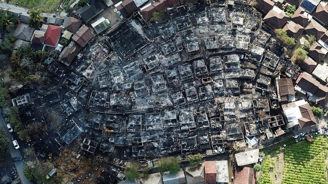 A drone view shows the aftermath of a fire at Sade, a traditional Sasak village that caught fire overnight in Lombok, West Nusa Tenggara province, Indonesia, August 23, 2026. REUTERS/Stringer
