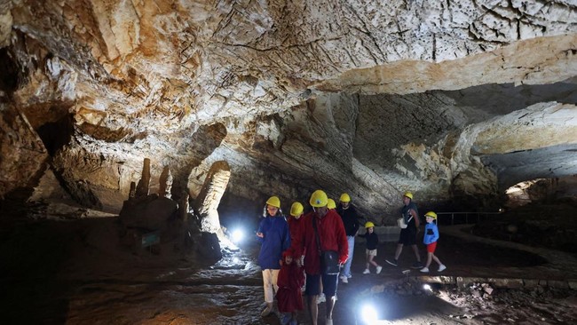 Tourists visit Vjetrenica Cave, a UNESCO World Heritage Site, where temperatures remain a constant 11 degrees Celsius (52 degrees Fahrenheit), to escape the summer heat as the Balkans endure repeated heatwaves, in Ravno, Bosnia and Herzegovina, July