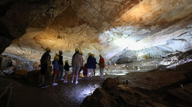 Tourists visit Vjetrenica Cave, a UNESCO World Heritage Site, where temperatures remain a constant 11 degrees Celsius (52 degrees Fahrenheit), to escape the summer heat as the Balkans endure repeated heatwaves, in Ravno, Bosnia and Herzegovina, July