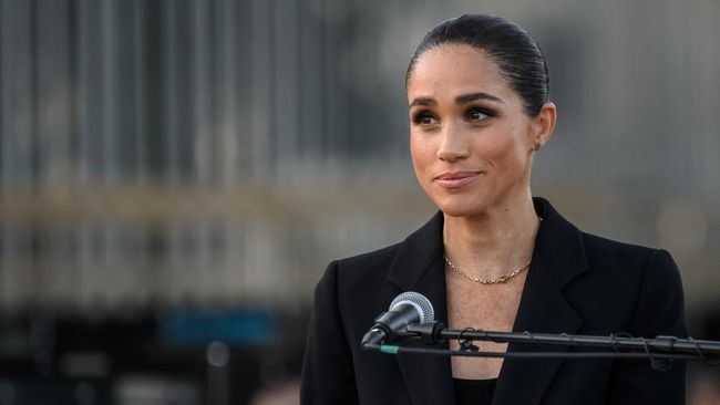 Britain's Meghan, the Duchess of Sussex delivers a speech at the opening of the Lost Screen Memorial, an art installation of giant illuminated smartphones representing 50 children who tragically lost their lives following harm linked to social media,