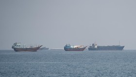 Vessels near the Strait of Hormuz, as seen from Musandam, Oman, August 24, 2026. REUTERS/Stringer