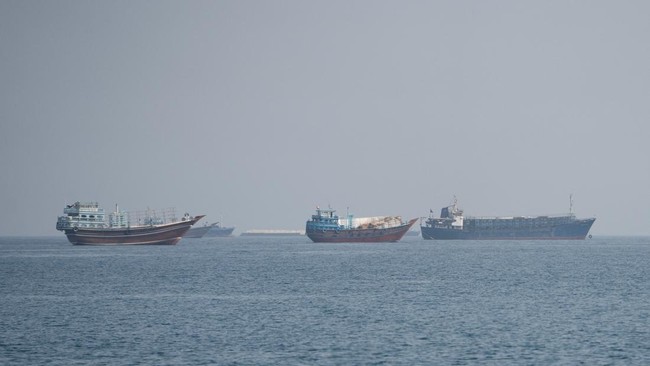 Vessels near the Strait of Hormuz, as seen from Musandam, Oman, August 24, 2026. REUTERS/Stringer