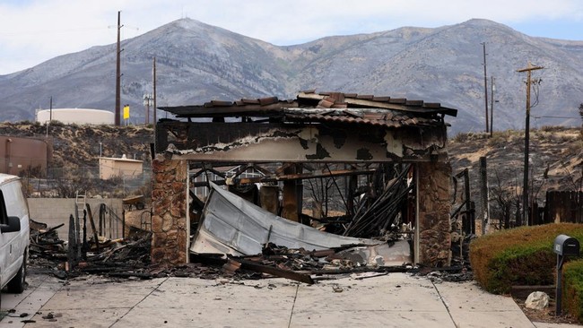 A home along Peppermint Drive was burned where the fire crossed Highway 395 after tens of thousands of people were evacuated over the weekend and many others were prepared to leave as the Hawk wildfire threatened north Reno, Nevada, U.S., August 24,