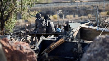 A statue in the charred remains of a home burned in the Hawk Fire in Reno, Nevada, U.S., August 24, 2026. REUTERS/Fred Greaves     TPX IMAGES OF THE DAY