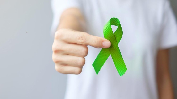 September World lymphoma and October Mental health day Awareness month&comma; Woman with lime green Ribbon color for supporting people living&comma; and illness&period; Healthcare concepts