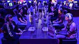 Gamers play the Crimson Desert video game of Pearl Abyss during at the Gamescom video games trade fair at the Trade Fair Center in Cologne, western Germany, on August 21, 2025. The 2025 edition of the vast Gamescom trade fair in Cologne, Germany, had