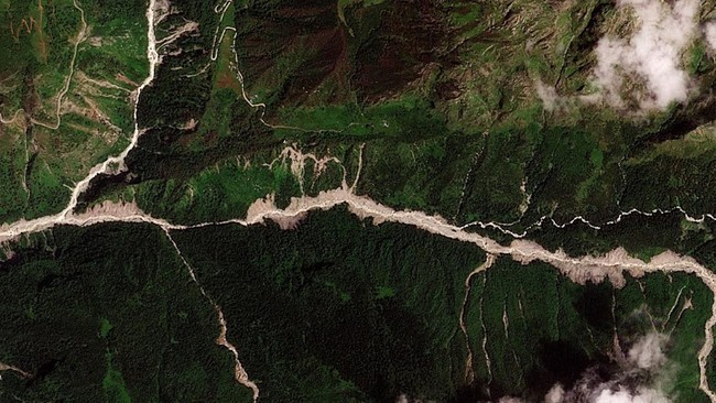 A satellite image shows the valleys near the Nepal-China border on August 25, 2026, before the devastating floods.  2026. PLANET LABS PBC/Handout via REUTERS