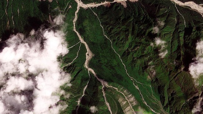 A satellite image shows the valleys near the Nepal-China border on August 25, 2026, before the devastating floods.  2026. PLANET LABS PBC/Handout via REUTERS