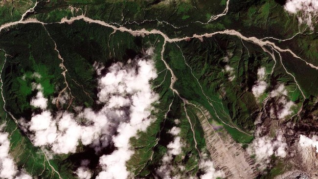 A satellite image shows the valleys near the Nepal-China border on August 25, 2026, before the devastating floods.  2026. PLANET LABS PBC/Handout via REUTERS