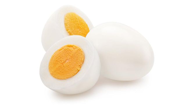 Hard-boiled chicken egg and half of egg on white background. File contains clipping path.