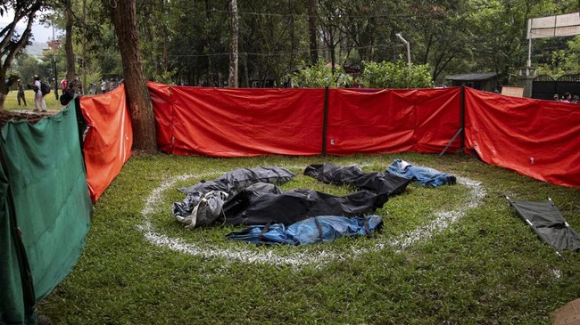 A general view shows deceased flood victims' bodies kept at Trishuli camp in Nepal's Nuwakot district on August 28, 2026. More than 1,400 people are missing and at least 552 have been killed after a devastating, tsunami-like wall of water gouged a pa