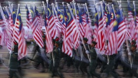 School cadets carry Malaysian flags during the 69th National Day celebrations in Putrajaya, Malaysia, August 31, 2026. REUTERS/Hasnoor Hussain
