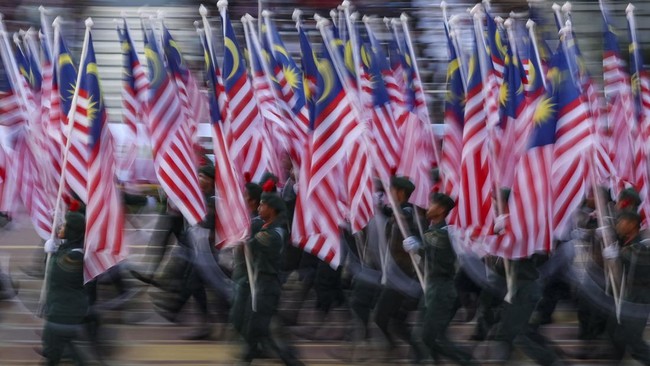 School cadets carry Malaysian flags during the 69th National Day celebrations in Putrajaya, Malaysia, August 31, 2026. REUTERS/Hasnoor Hussain