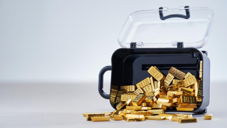 transparent luggage filled with small gold bar&period;