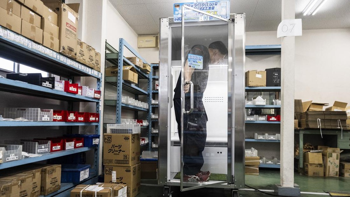Konoe employee Taichi Konishi enters a cooling box for workers also known as a