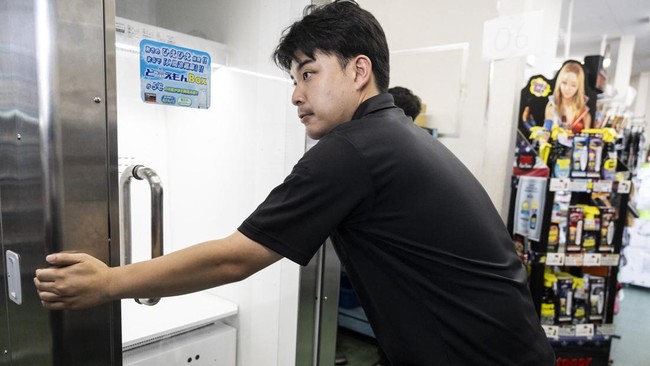 A Konoe employee moves a cooling box for workers also known as a