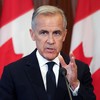 Canadian Prime Minister Mark Carney speaks at a press conference in Ottawa, Ontario, on August 22, 2026 after trade talks with the US collapsed. Carney said his country could not accept US terms for a trade deal, and would slap retaliatory tariffs on