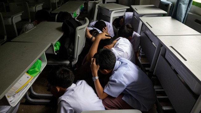 Students take cover during an active-shooter drill following recent school shootings in the country, at Carlos F. Gonzales High School in San Rafael, Bulacan, Philippines, September 3, 2026. REUTERS/Eloisa Lopez