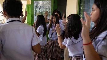 Students walk with their arms raised at the conclusion of an active-shooter drill following recent school shootings in the country, at Carlos F. Gonzales High School in San Rafael, Bulacan, Philippines, September 3, 2026. REUTERS/Eloisa Lopez