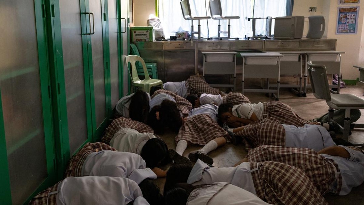 Students take cover during an active-shooter drill following recent school shootings in the country, at Carlos F. Gonzales High School in San Rafael, Bulacan, Philippines, September 3, 2026. REUTERS/Eloisa Lopez