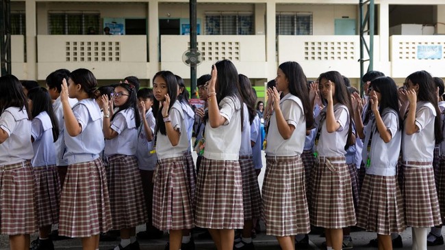 Students gather with their arms raised at the conclusion of an active-shooter drill following recent school shootings in the country, at Carlos F. Gonzales High School in San Rafael, Bulacan, Philippines, September 3, 2026. REUTERS/Eloisa Lopez
