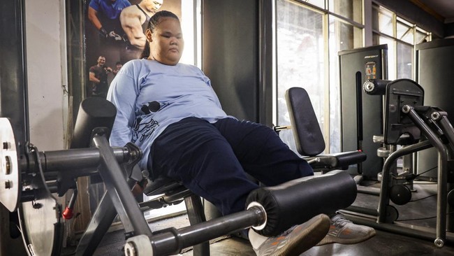 Intan Permatasari, 15, exercises at a gym in Bogor, West Java province, Indonesia, August 20, 2026. Intan's confidence has returned as her weight has dropped. She goes to the gym, eats out with her parents, and returned to school last month. She stil